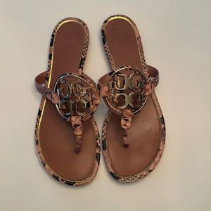 Great pair of Tory Burch printed sandals with large signature logo.